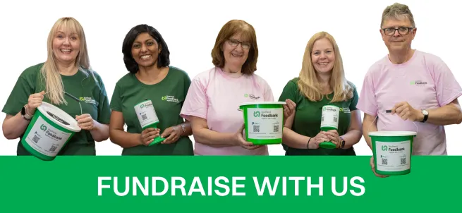 Image of volunteers and staff with donation buckets