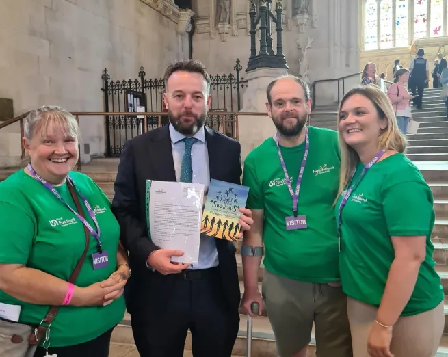 4 people stand in Westminster hall