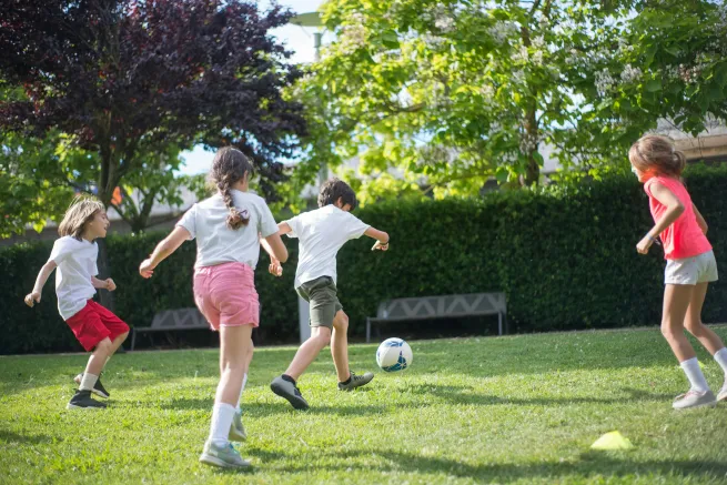 children playing football