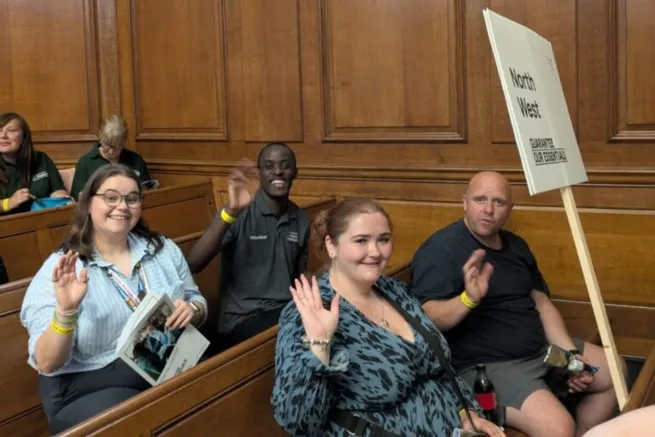 Four campaigners sitting in meeting room