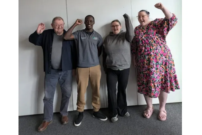 Four campaigners cheering
