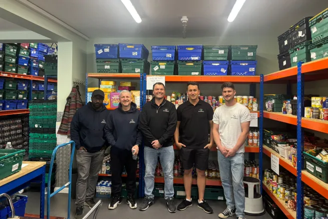 DP world staff help in food bank store room