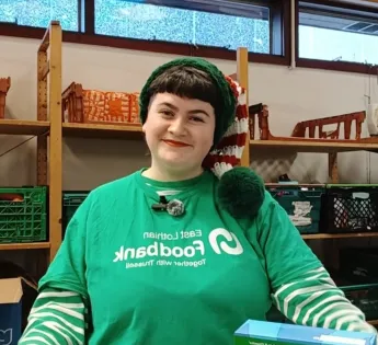 Picture of Isla in an elf hat smiling