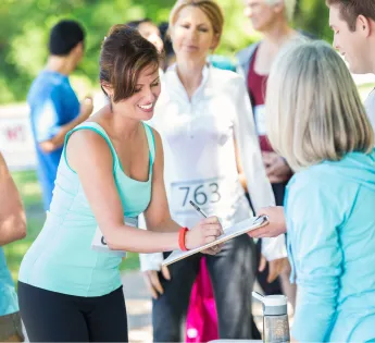 a woman getting ready to run a sponsored race