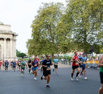 Runners in Hyde Park with Wellington Arch in background
