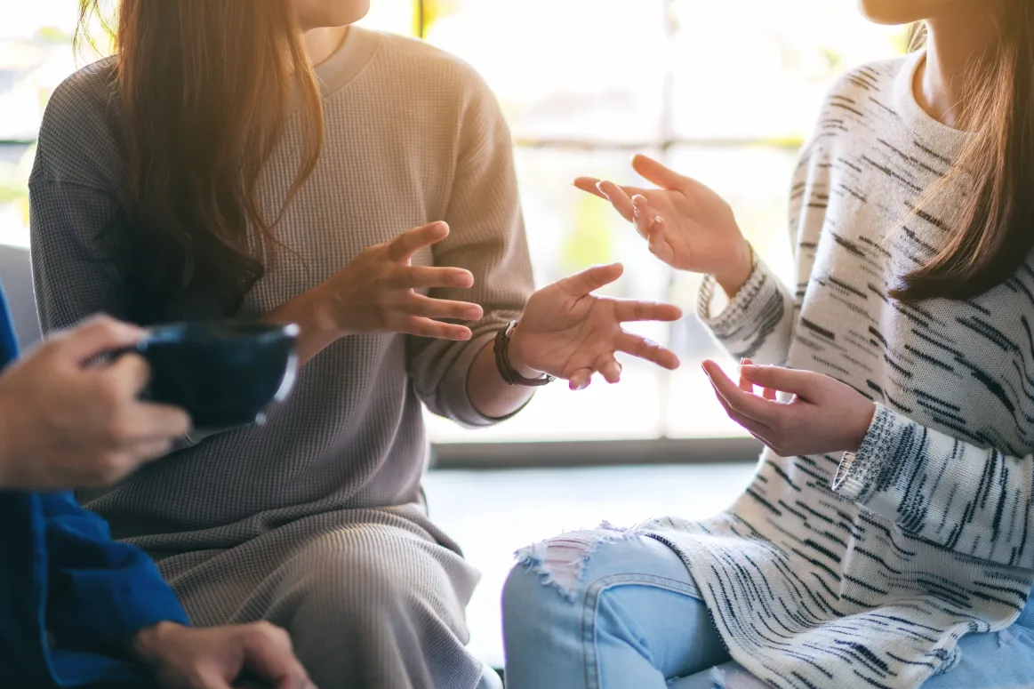 group of people sitting and talking
