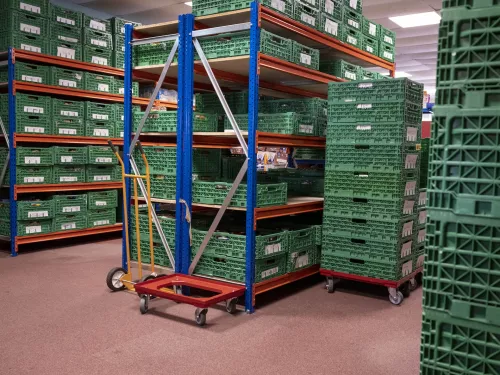 Stacked containers full of food in the Lisburn food bank warehouse