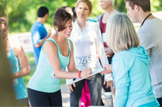 a woman getting ready to run a sponsored race