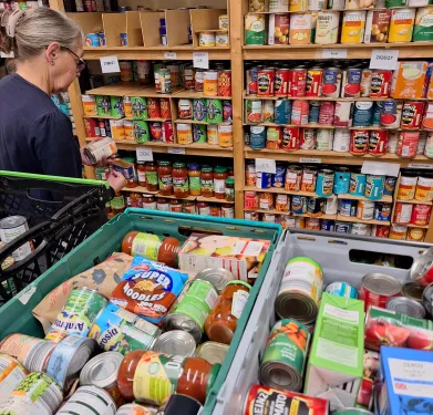 Volunteer sorting food donations