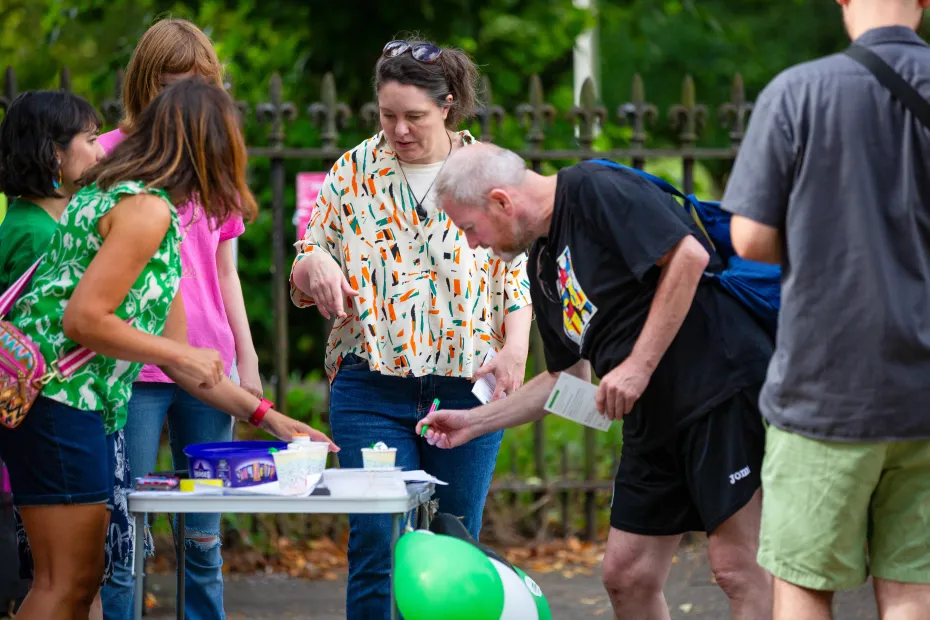 Supporters signing petition at action event