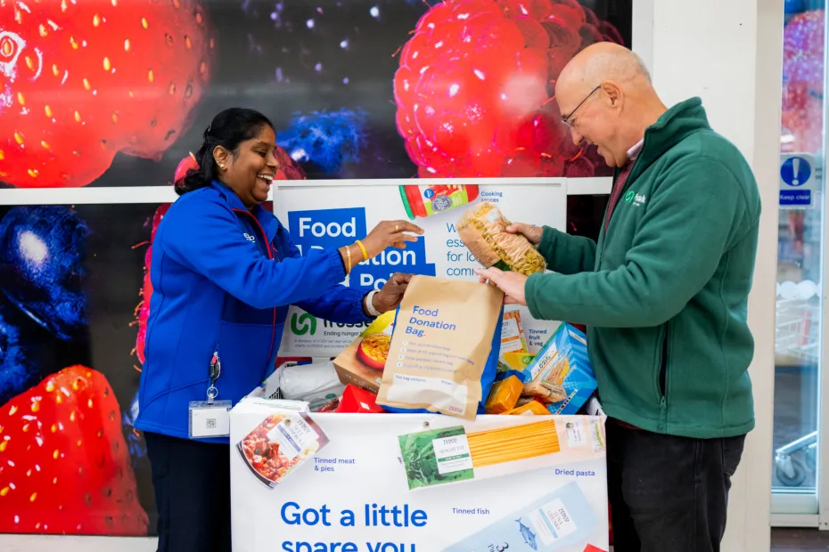 Tesco staff member and food bank volunteer collect food donations