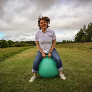Photos shows East Lothian Foodbank team member Lucy bouncing on space hopper
