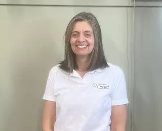 Image of women in white tshirst, brown hair