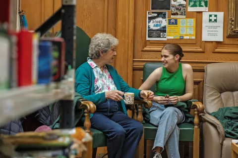 Two people have a conversation