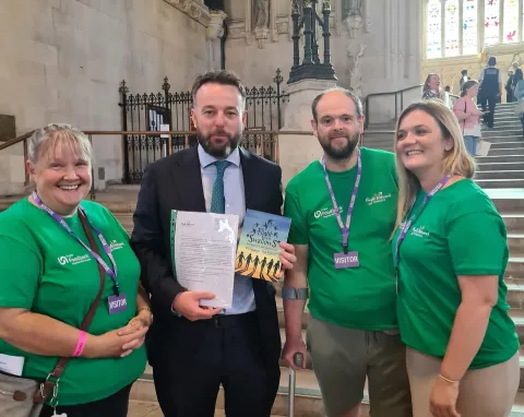 4 people stand in Westminster hall