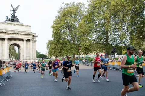 Runners in Hyde Park with Wellington Arch in background