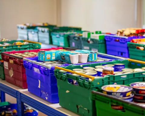 Crates of tinned food in a food bank warehouse